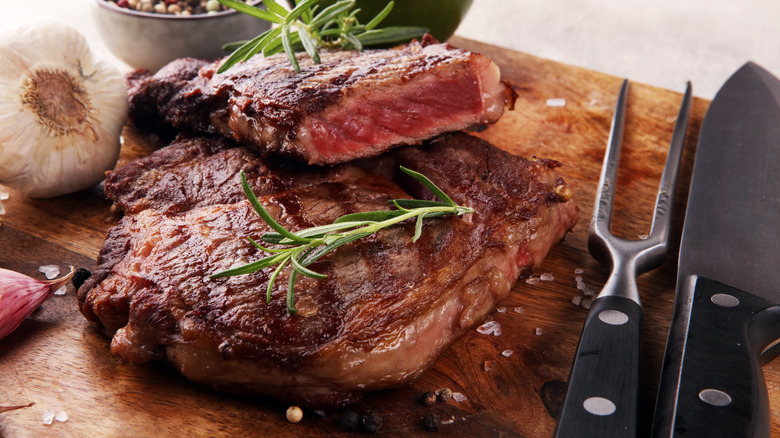 A slab of prime rib topped with garnish