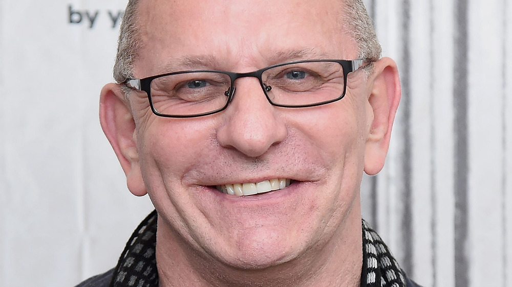 Robert Irvine smiling with glasses