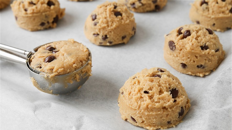 chocolate chip cookie dough balls on cookie sheet