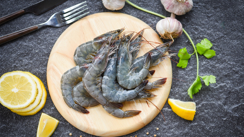 raw shrimp on cutting board