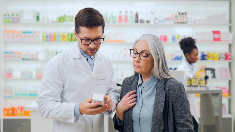 pharmacist helping a customer in a store pharmacy