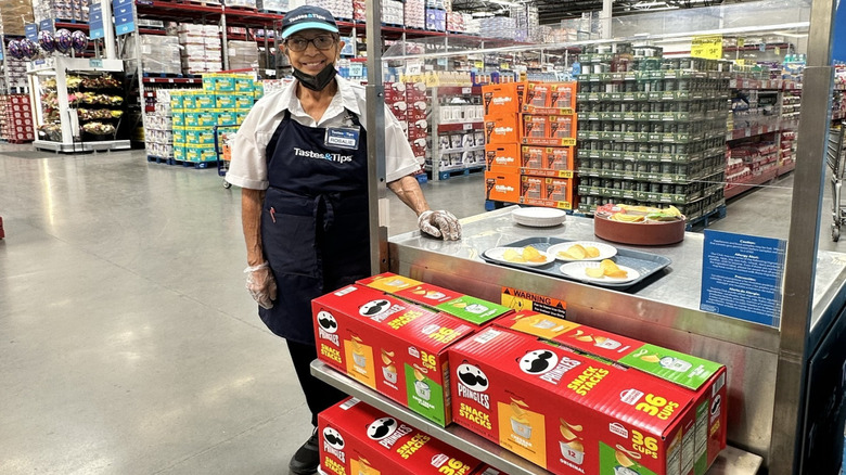 attendant handing out Sam's Club samples