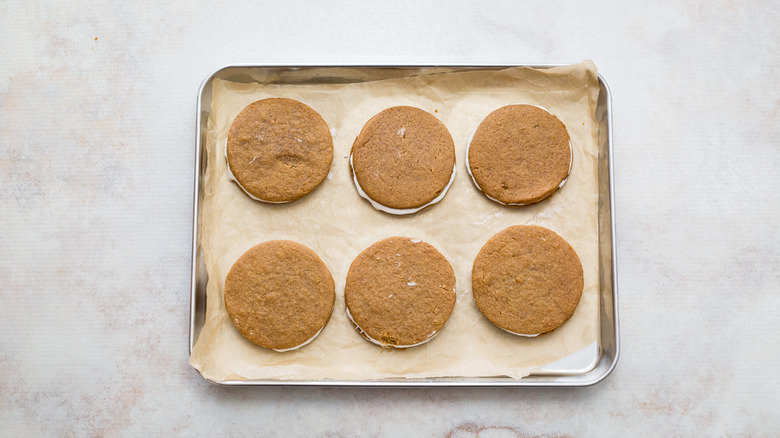 filled cookies on cookie sheet