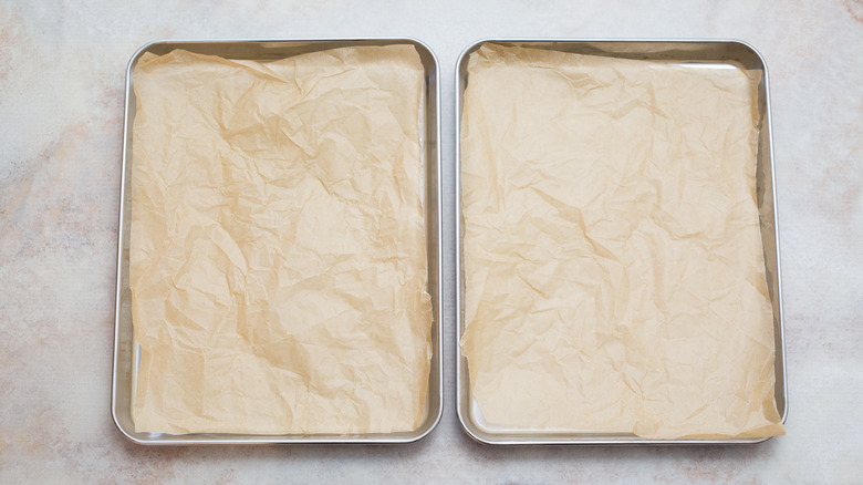 lined cookie sheets on table