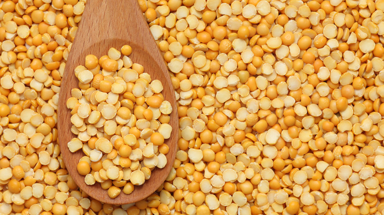 Yellow split peas with wood spoon
