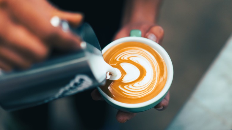 Barista making latte art