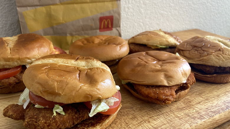 diagonal view of all six sandwiches and McDonald's bag