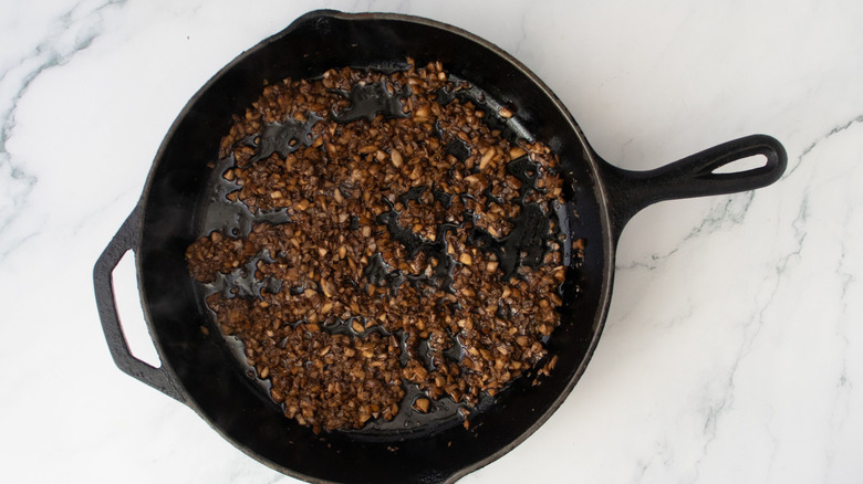Sauteed minced mushrooms in skillet