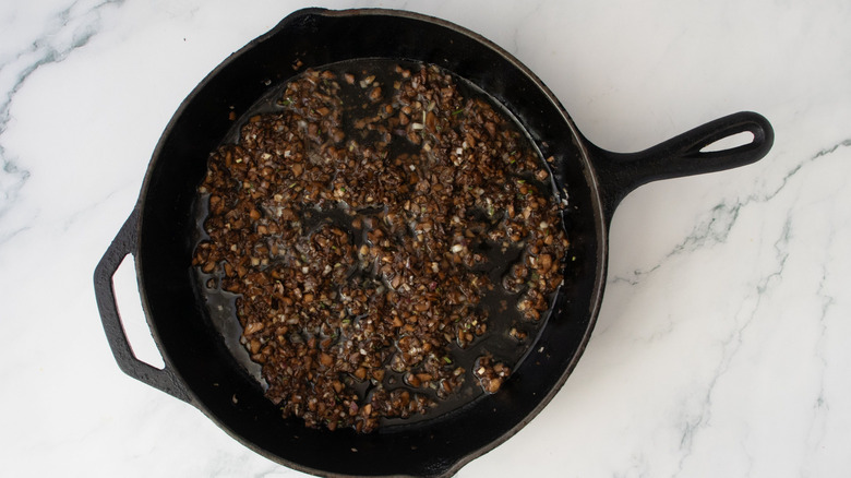 Sauteed minced mushrooms in skillet