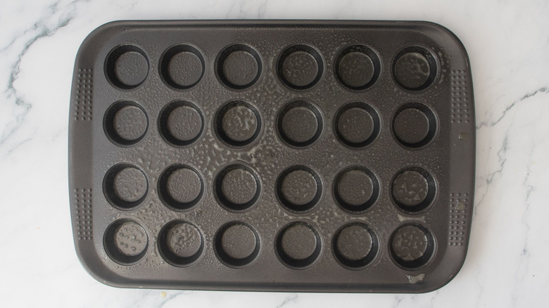 Mini muffin tin sprayed with cooking oil