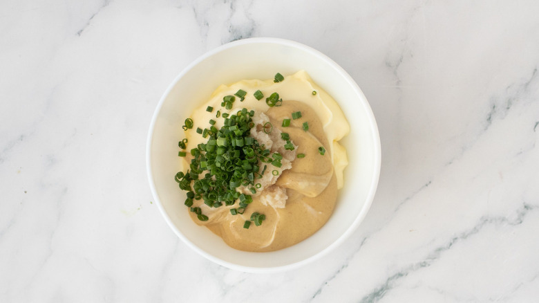 Mustard and chives in bowl