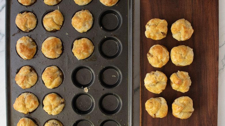Pastry bites in tin and on wooden board