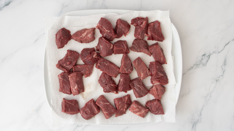 Steak pieces on paper towels