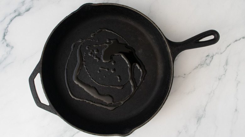 Drizzle of oil in skillet