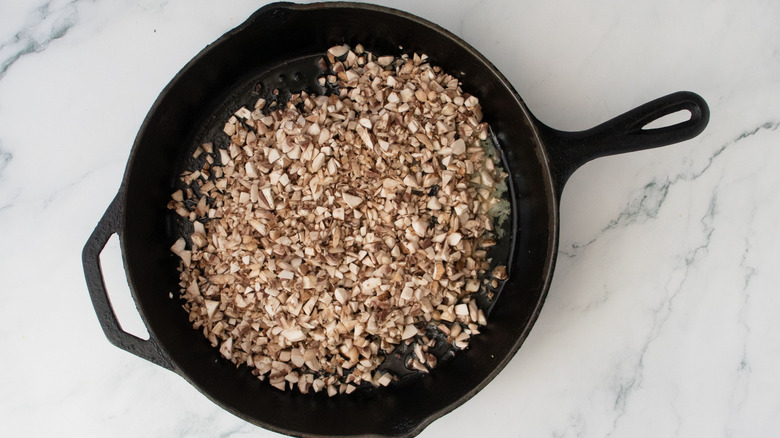 Chopped mushrooms in skillet