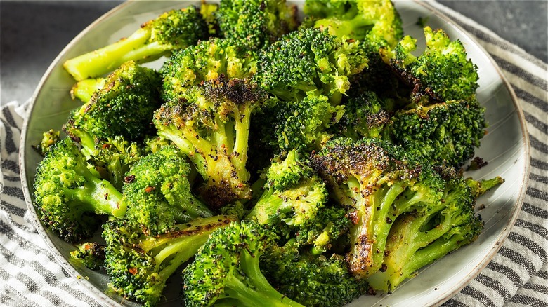 Roasted seasoned broccoli in bowl