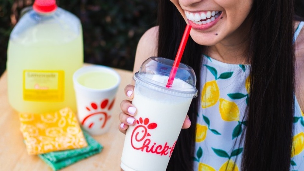 Woman drinking Chick-Fil-A lemonade