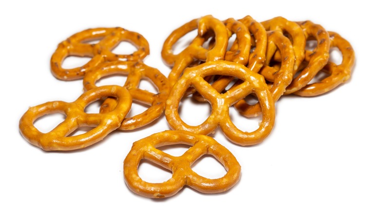 pile of snack pretzels on a white background
