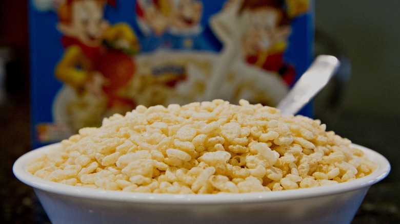 Close-up of a bowl of Rice Krispies in front of cereal box