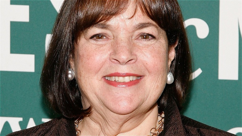 Ina Garten with wide smile and pearl earrings