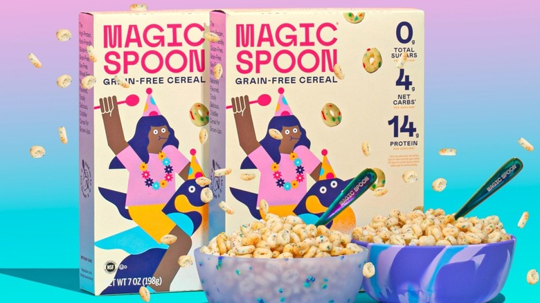 Magic Spoon cereal o's falling on rainbow background