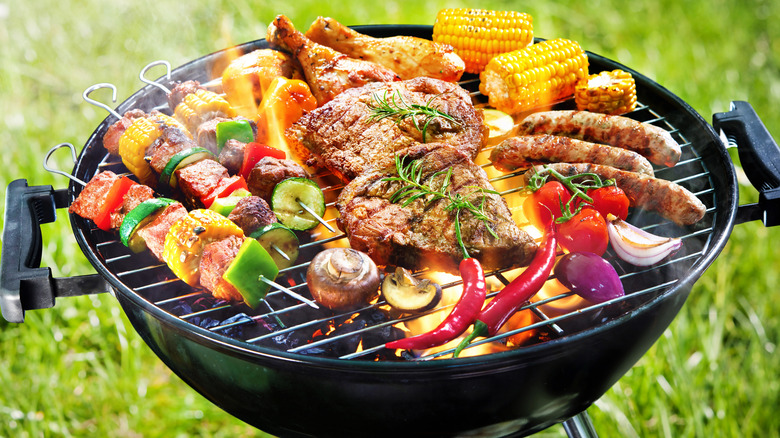 grill loaded with meat and vegetables
