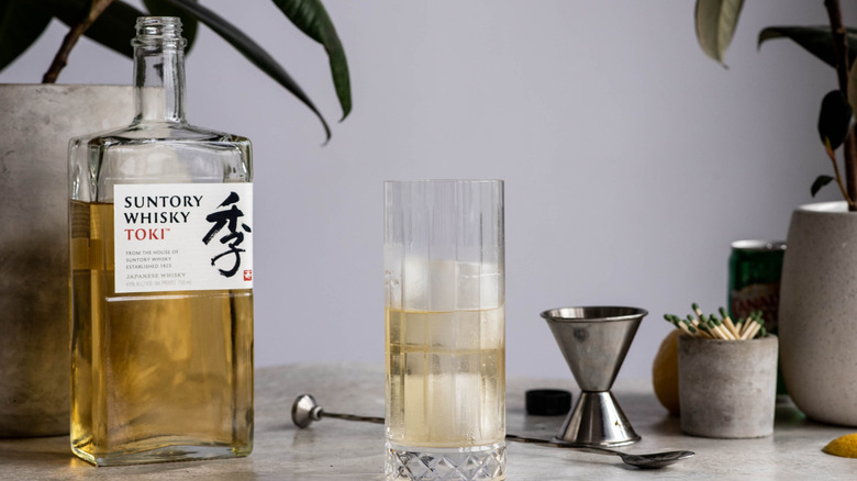 bottle of Japanese whiskey with glass and jigger