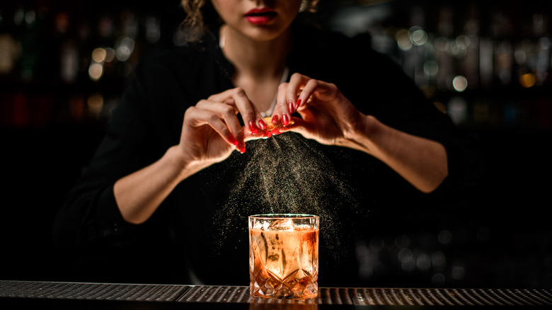 Bartender makes an old fashioned