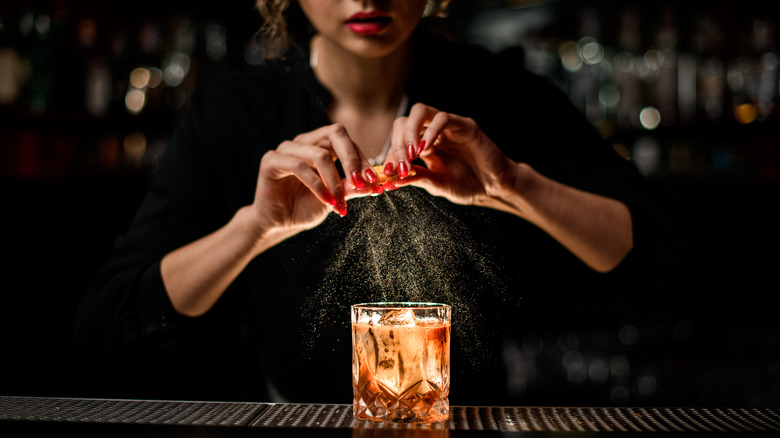 Bartender makes an old fashioned