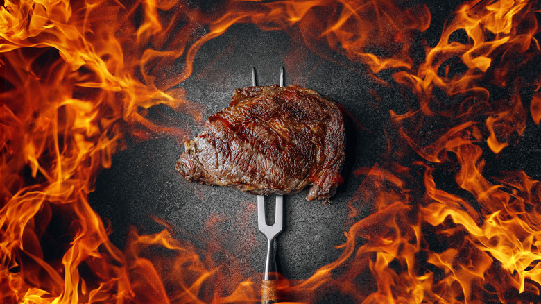 Grilled beef steak and fire 