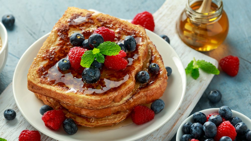 plate of french toast with berries