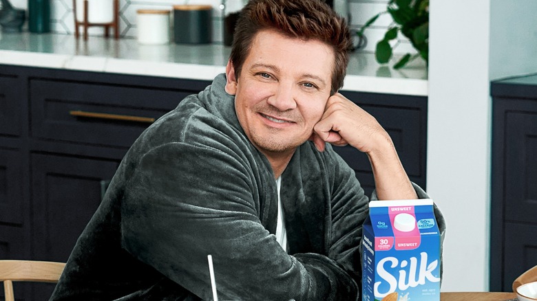 Jeremy Renner at table with Silk milk in foreground