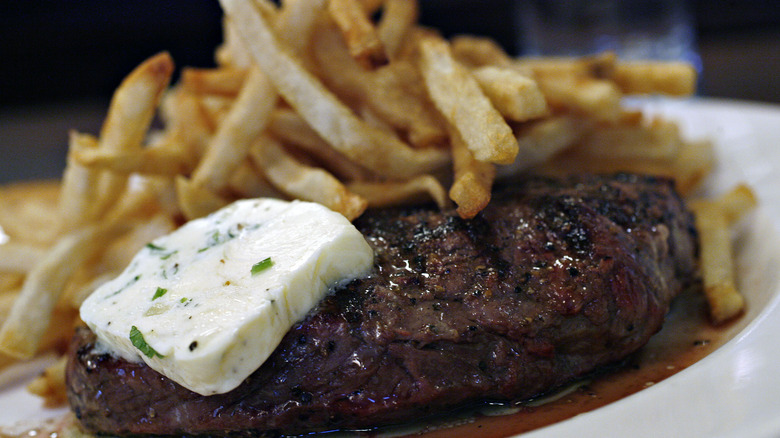 Steak topped with flavored butter