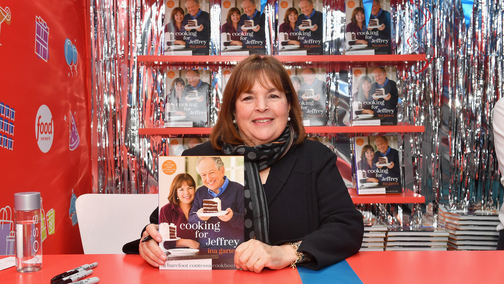 Ina Garten holding cookbook