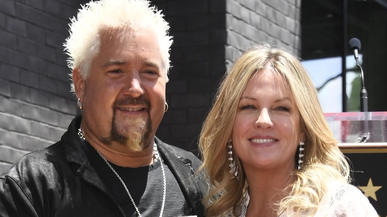 Guy Fieri smiles with wife Lori Fieri