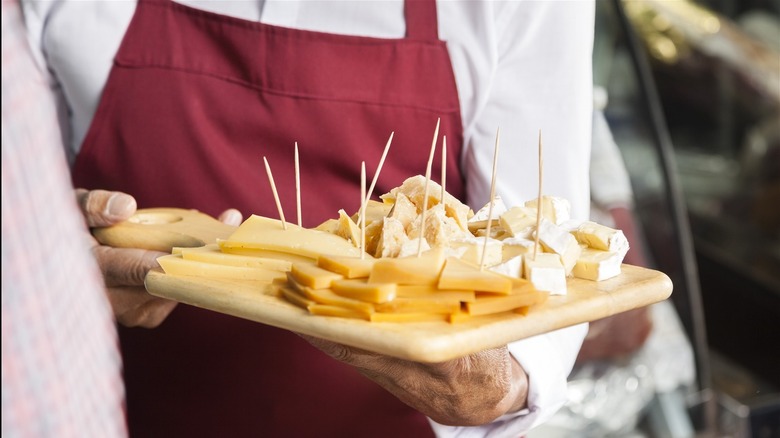 cheese samples on wooden board