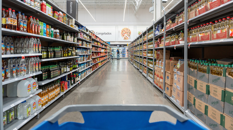 Shopping cart heading down Costco aisle
