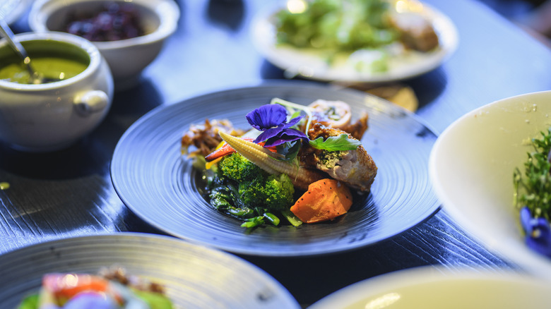 Salad in bowl with flowers 