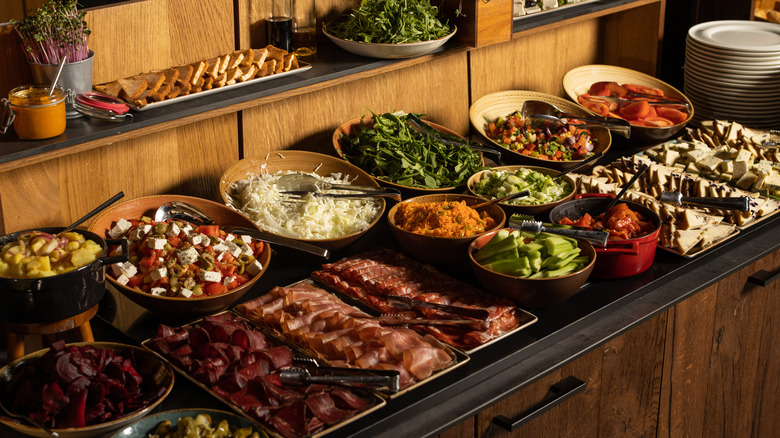 Display of meats, bread, and vegetables