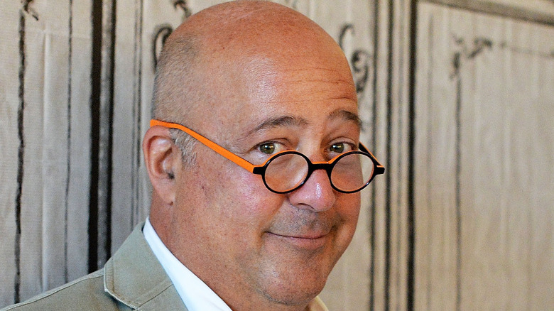 andrew zimmern smirking