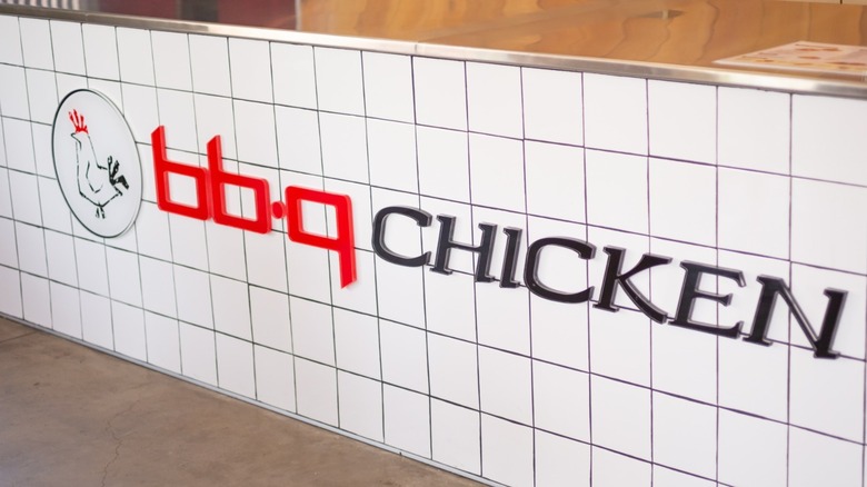 Store sign for bb.q Chicken brand logo