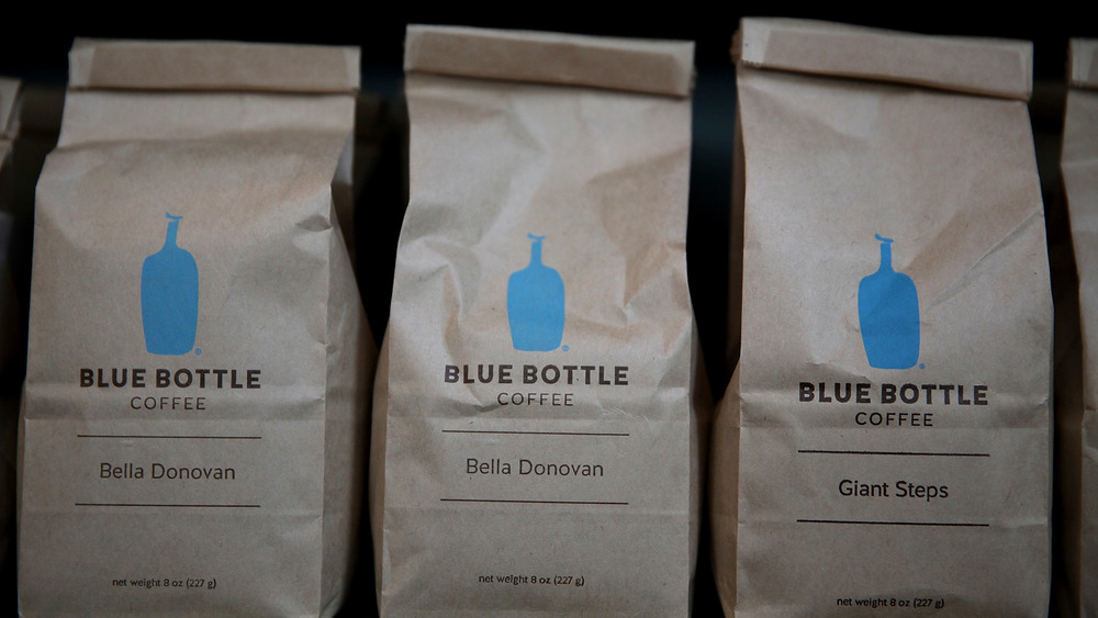 Three brown bags of Blue Bottle Coffee