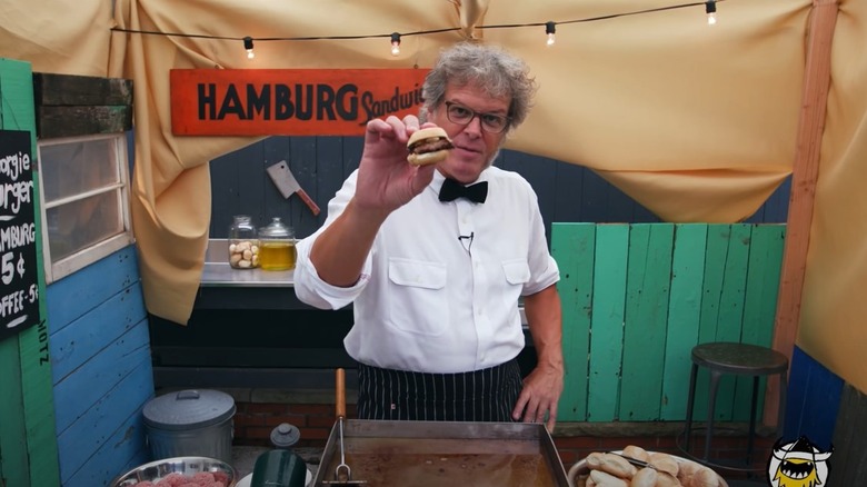 George Motz holding a burger