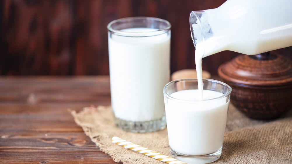 Buttermilk being poured into glassware