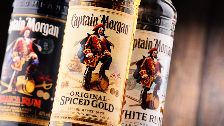 thee bottles of Captain Morgan