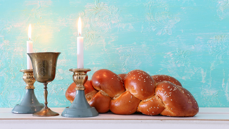Challah with wine cup and candles