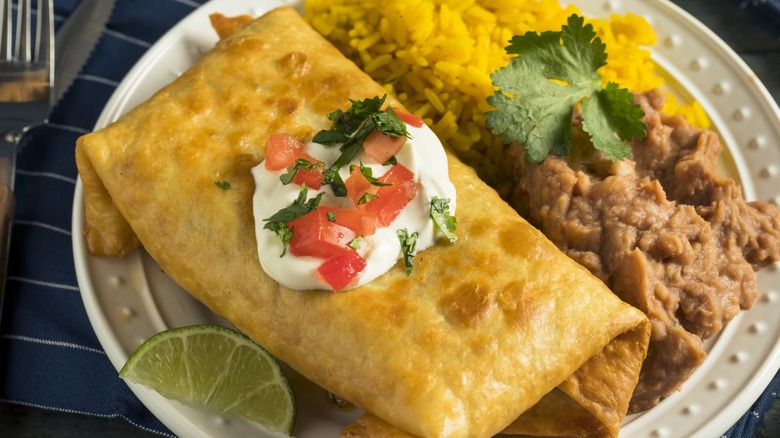 Chimichanga served with beans and rice