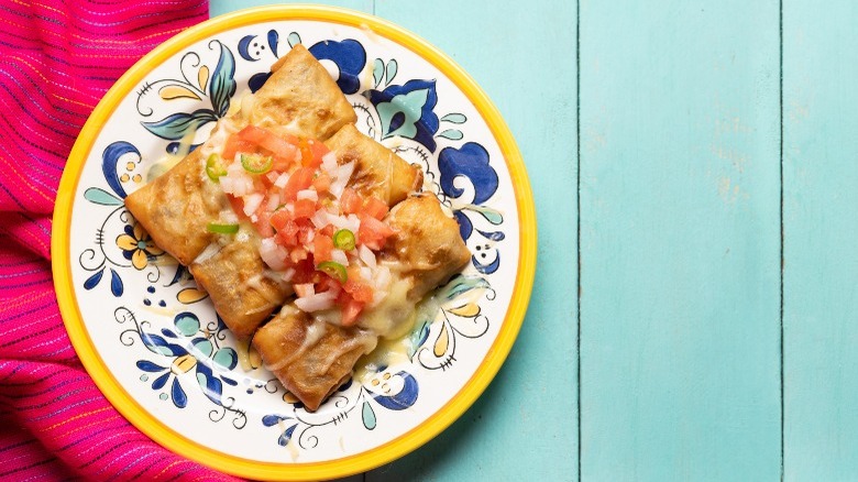 Chimichangas on blue and white patterned plate