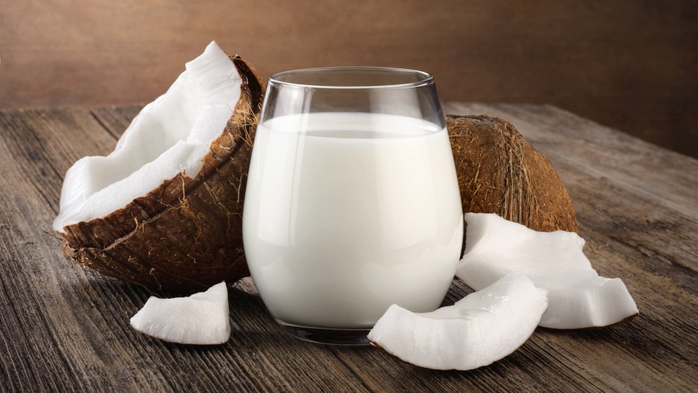 Coconut and glass of coconut milk