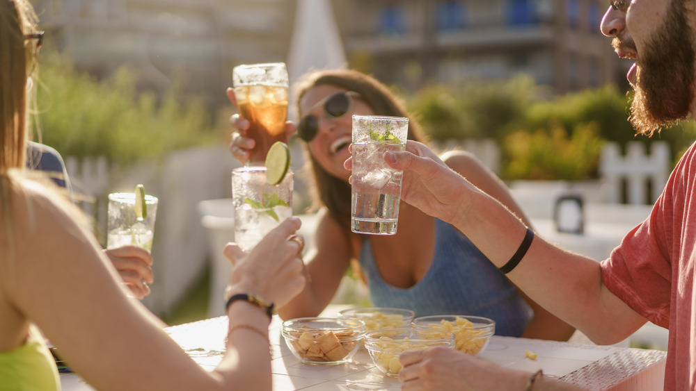 friends raising glasses in toast